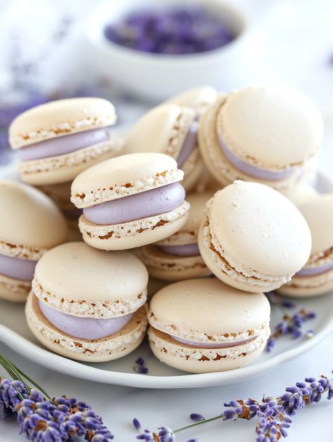 Lavender Macarons   𝗜𝗻𝗴𝗿𝗲𝗱𝗶𝗲𝗻𝘁𝘀: 💜  1 cup powdered sugar 3/4 cup almond flour 2 large egg whites, room temperature 1/4 cup granulated sugar 1/2 teaspoon lavender extract Purple gel food coloring 1/2 cup unsalted butter, softened 1 1/2 cups powdered sugar (for filling) 1 tablespoon heavy cream Dried lavender buds for garnish Lavender Macrons, Lavender Macaron, Lavender Macarons, Italian Foods, Lavender Extract, Gel Food Coloring, Lavender Buds, Dried Lavender, Egg Whites