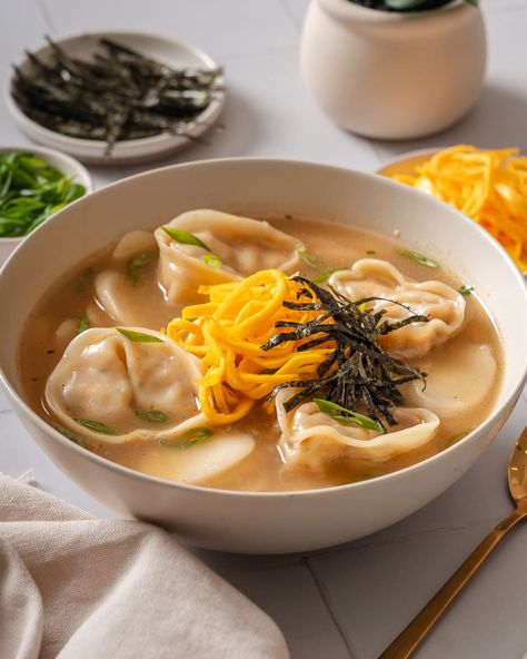 Tteok Mandu guk (Korean Rice Cake Soup with Dumplings) – Takes Two Eggs Korean Soup Dumplings, Tteok Mandu Guk, Mandu Soup, Mandu Guk, Korean Mandu, Mandu Soup Korean Food, Mandu Recipe, Mandu Korean, Soup Korean