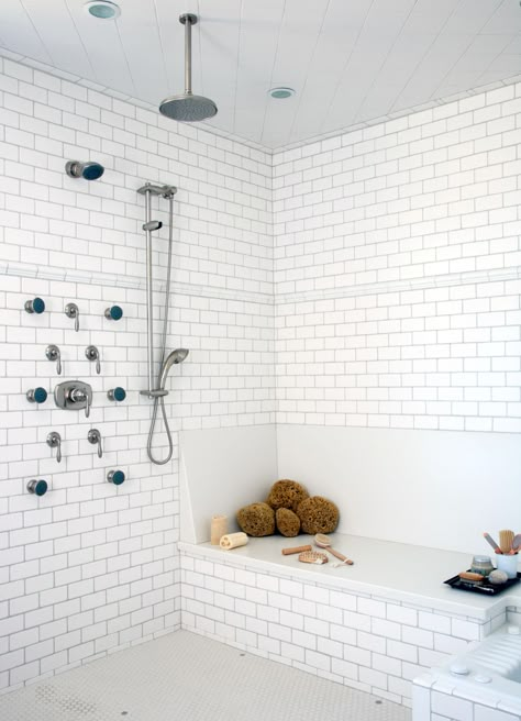 Walk-in showers are a practical, attractive choice for bathrooms large and small. Create a gorgeous walk-in shower with our tips on tile treatments, lighting, layout, storage, and more. Whether you're working with a tight space or have room to fill, these walk-in shower ideas will add a little luxury to your every day. #bathrooms #walkinshowers #walkinshowerideas #bathroomideas #bhg White Tiled Bathroom, Built In Shower Seat, Shower Dimensions, Tiled Bathroom, Walk In Shower Designs, Glass Shower Enclosures, Small Showers, Shower Seat, Shower Bench