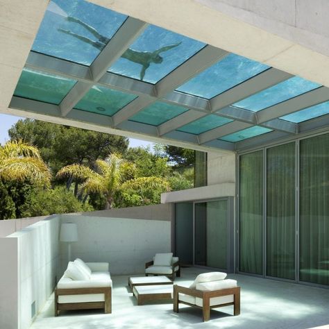 The glass-bottomed pool projects out across a semi-enclosed terrace that has a rippled light effect from the water above. Villas In Italy, Miami Houses, Concrete House, Glass Floor, Rooftop Pool, Swimming Pool Designs, Design Hotel, Roof Top, Apartment Garden