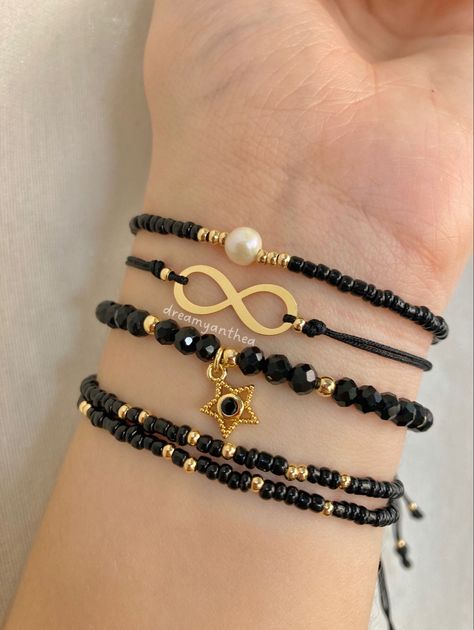 set de cuatro pulseras variadas de color negro con dijes dorados Black Bracelets Aesthetic, Black Aesthetic Bracelets, Ideas Para Pulseras Aesthetic, Aesthetic Black Bracelet, Casual Black Handmade Bracelets, Casual Handmade Black Bracelets, With Love Aesthetic, Aesthetic Bracelet Ideas, Pulseras Aesthetic