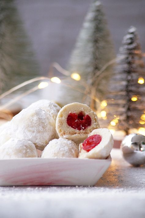 Cherry Snowball Cookies – Buttery, crumbly, and delicious snowy cookie filled with cherries. An irresistible holiday treat for any cookie lover! What are cherry snowball cookies? Snowballs, also known as Russian tea cakes or Mexican wedding cookies, are bite-sized, buttery cookies that are rolled in powdered sugar, which gives them a white, snow-like appearance. They... Cherry Snowball Cookies, Snowball Cookie, Best Cookie Recipe Ever, Russian Tea Cakes, Christmas Snowball, Snowballs Recipe, Snowball Cookie Recipe, Russian Tea Cake, Best Holiday Cookies