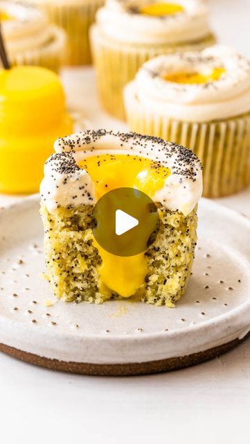 Camila Hurst on Instagram: "These Lemon Poppy Seed Cupcakes are sweet and fluffy with a lemon curd filling and cream cheese frosting. Each bite has a layer of chewy, nutty poppy seeds, sweet lemon cake, zesty lemon curd, and creamy frosting overflowing with fresh citrus flavor. 
To get the recipe comment “lemon cupcake” and it will be sent to your inbox 💛

#lemoncake #cupcakes #cupcakesofinstagram #cupcakelove" Camila Hurst, Poppy Seed Cupcakes, Lemon Poppy Seed Cupcakes, Lemon Cupcake, Creamy Frosting, Curd Filling, Lemon Curd Filling, Lemon Poppy Seed, Lemon Poppy