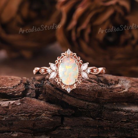 Unique Opal Engagement Ring Rose Gold Ring Nature Inspired Ring Leaf Floral Ring Vintage Moissanite Ring Art Deco Promise Rings for Women If you want to see more pictures of other gemstone rings, you can click on the links below. Moissanite: https://www.etsy.com/listing/1558807664 Alexandrite: https://www.etsy.com/listing/1585914484 RING INFORMATION ★ Engagement ring ⊹Center Stone - Natural Opal    Cut - Oval shaped    Size - 5x7mm       ⊹Side Stone - Moissanite /Natural Diamonds    Weight: About 0.212ct    Cut - Marquise & Round shaped    Clarity - SI-VS    Color- G-H ⊹Band width - 1.5mm ⊹Metal - 14k or 18k solid gold (available in yellow, white or rose gold) ⊹Ring size - any sizes (size above 9 will be priced individually) Enter my shop: www.etsy.com/shop/ArcadiastudioUS MAKING & SHIPPIN Fairytale Engagement Rings, Opal Engagement Ring Rose Gold, Fire Opal Engagement Ring, Vintage Opal Engagement Ring, Unique Opal, Opal Engagement Ring, Cute Engagement Rings, Future Engagement Rings, Nature Inspired Rings