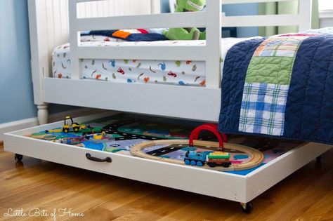 Repurposed Train Table - With a new baby in our family, we quickly ran out of room for our train table. After a few modifications, we were able to repurpose it… Table Lego Diy, Train Table Storage, Bed Kind, Table Lego, Lego Table With Storage, Diy Storage Bed, Underbed Storage Drawers, Diy Toy Storage, Toy Storage Solutions