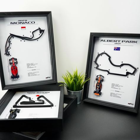 🎨 Welcome to the captivating world of F1 collector's items, where craftsmanship meets a passion for Formula 1! Our handmade artworks are the perfect gift for motorsport enthusiasts who want to bring home a unique piece of emotion and adrenaline. 🌍 Iconic Circuits, Authentic Details: Each artwork, measuring 40cm x 30cm x 6cm, is a blend of elegance and history. The black wood, carefully painted, frames one of the 24 F1 circuits of your choice. Immersed in authentic details, the artwork also fea F1 Circuits, F1 Artwork, F1 Wall Art, Lego Room Decor, Painted Frames, F1 Art, Cars Room, Creative Gift Wraps, Lego Room