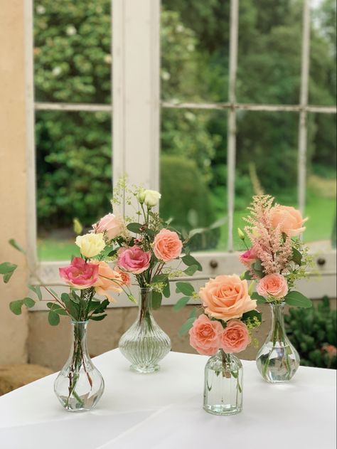 Flowers for the welcoming guests table. #syonpark #syonwedding #peachroses #weddingflowers #budvases #londonflorist Wedding Table Posy, Small Posy Floral Arrangements, Small Table Flowers, Petals And Prosecco Centerpieces, Flower Jars Decoration, Simple Flower Arrangements For Table, Small Flower Arrangements For Tables, Flowers In Small Vases, Carnation Wedding Centerpieces