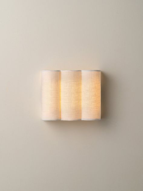 Artistic and elegant. Make a simple statement with the subtle nature of the Folia Wall Light. The Folia collection embraces an artisanal spirit, featuring a fluted linen design that brings an organic and handcrafted touch to each piece.