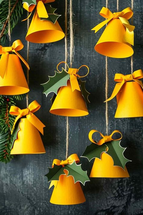 29 Construction Paper Christmas Crafts: Fun, Festive DIY Projects! Christmas Decorations Paper Craft, Kids Christmas Garland Craft, Christmas Tree Craft Decorations, Xmas School Decorations, School Decorations Christmas, Christmas Decor Ideas Diy Crafts Kids Projects, Christmas Hanging Craft, Paper Bells Christmas, Christmas Paper Diy Decoration