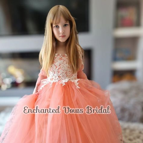 Coral Flower Girl Dress, Princess Dress -Link in bio. Flower Girl Dress in Coral, Ivory, Champagne or any colour you choose. Please message me. 🌹 A beautiful floor length tulle flower girl dress with a full tulle skirt to make your little girl feel like a true princess. This dress is made from the finest materials with exquisite embroidery and lace applique on the sleeves and front of the dress Finished with a large fluffy tulle bow, with a zip and buttons up the back. Available in Coral... Peach Flower Girl Dress, Coral Flower Girl Dresses, Pink Princess Tutu Dress With Floral Applique, Princess Tutu Dress With Bow For Dress-up, Yellow Princess Dress Kids, Full Tulle Skirt, Tulle Bows, Flower Girl Dresses Tulle, Lace Applique