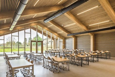 Les Coteaux Fleuris School by HEMAA and Hesters Oyon | Inhabitat - Green Design, Innovation, Architecture, Green Building 2022 Picture, Timber Buildings, Photovoltaic Panels, Farm Buildings, Pitched Roof, Green Building, Contemporary Architecture, Halle, Picture Gallery