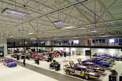 Former NASCAR team Michael Waltrip Racing puts racing shop up for sale. The MWR headquarters was a formerly a movie theatre.   https://racingnews.co/2016/01/10/michael-waltrip-racing-shop-for-sale/ #michaelwaltripracing Race Shop Garages, Nascar Photos, Bristol Tn, Nascar Champions, Race Car Driver, Car Workshop, Luxury Garage, Mechanic Garage, Movie Theatre