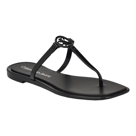 PRICES MAY VARY. Chic and stylish, the Calvin Klein Edhen sandal is a must have for your wardrobe. This sandal features a sleek design, CK logo detailing on the upper and slip-on silhouette. Founded in New York in 1968, the brand elevates everyday essentials to globally iconic status. Open/SquareToe Slip-on Closure Calvin Klein Slides, Classy Sandals, Calvin Klein Sandals, Presents Ideas, Ck Logo, Black Sandals Flat, Calvin Klein Shoes, Slides Women, Synthetic Rubber