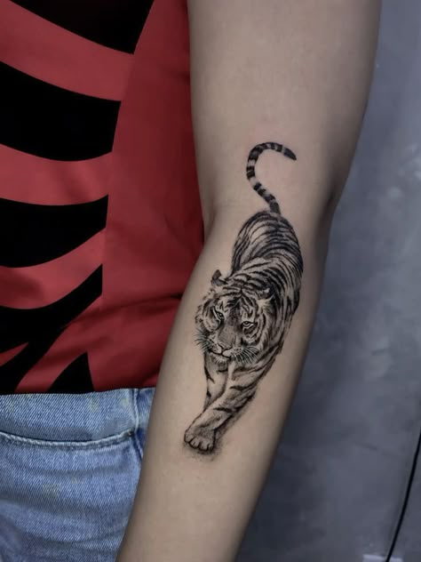 Hidden Tiger Tattoo, Pouncing Tiger Tattoo, Shaded Tiger Tattoo, Tiger Tattoo Back Of Arm, Tiger Tattoo Realism, Tiger On Back Tattoo, Tiger Foot Tattoo, Tiger Tattoo Ribs, Tiger Wrist Tattoo