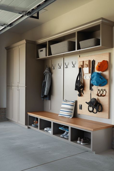 25 Eye-Catching Garage Mudroom Upgrades Coat Rack Garage, Baseball Garage Storage, Garage Nook Ideas, Garage Entry Makeover, Garage Cabinet Colors, Garage Zones Ideas, Garage Lockers With Bench, Garage Organization Ideas Shoes, Garage Shoe Bench