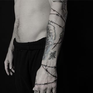 Wrapped in barbed wire Arm Wrap Tattoo, Barbed Wire Tattoos, Wrap Around Wrist Tattoos, Thorn Tattoo, Wrap Around Tattoo, Around Arm Tattoo, Wrap Tattoo, Forearm Tattoo Women, Cool Small Tattoos