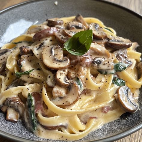 Tagliatelle Carbonara with Mushrooms 🍝🍄 Ingredients: - 300g tagliatelle - 150g mushrooms (sliced) - 2 eggs - 100g grated parmesan - 2 cloves garlic (minced) - 150ml crème fraîche - Olive oil - Salt and pepper (to taste) - Fresh parsley (to garnish) Instructions: 1. Start by bringing a large pan of salted water to the boil. Once boiling, add the tagliatelle and cook according to the packet instructions until al dente. Remember to reserve about a cup of the cooking water before draining the p... Tagliatelle Carbonara, Creamy Mushroom Pasta, Mushroom Pasta, Pasta Fresca, Jambalaya, 2 Eggs, Fresh Parsley, Couscous, Minced Garlic