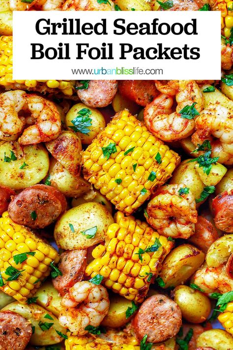 Grilled Seafood Boil Foil Packets are hearty, satisfying, and feed a crowd! In this classic southern dish, shrimp, sausage, corn, and potatoes are well-seasoned and grilled in foil packets for fast, easy cooking and fast, easy cleanup. Perfect for summer picnics, barbecues, and potlucks! Get the full recipe on UrbanBlissLife.com. Shrimp Boil Foil Packets Grill, Shrimp Boil On The Grill In Foil Pan, Seafood Recipes For A Crowd, Low Country Boil Foil Packets, Shrimp Boil Foil Packets, Corn And Potatoes, Shrimp Boil Foil, Foil Packet Dinners, Country Boil