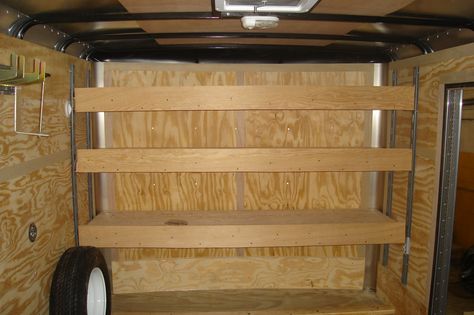 Plywood shelves supported on vertical E-track Enclosed Trailer Cabinets, Enclosed Utility Trailers, Utility Trailer Upgrades, Trailer Shelving, Utility Trailer Camper, Track Shelving, Build Shelves, Enclosed Trailer Camper, Homemade Trailer