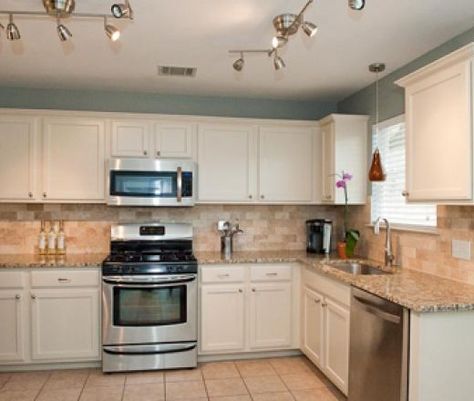 white kitchen cabinets granite countertop and tan walls | Welcome ... Travertine Kitchen, Kitchen Cream, Tan Kitchen, Blue Kitchen Walls, Cream Kitchen Cabinets, Light Blue Kitchens, Cream Cabinets, Tan Walls, Kitchen Remodel Countertops