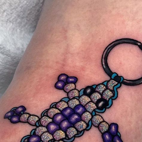 ✨Amanda Graves✨ 𝑔𝓁𝒾𝓉𝓉𝑒𝓇 𝓉𝒶𝓉𝓉𝑜𝑜𝓈 on Instagram: "Nostalgia glitter tattoos >>> Back of the knee too!✨🖤" Amanda Graves Tattoo, Small Glitter Tattoo, Make Your Own Luck Tattoo, Glitter Style Tattoo, Nostalgia Tattoo Ideas, Glitter Tattoos Real, Silly Little Tattoos, Glitter Tattoo Ideas, Bead Tattoo