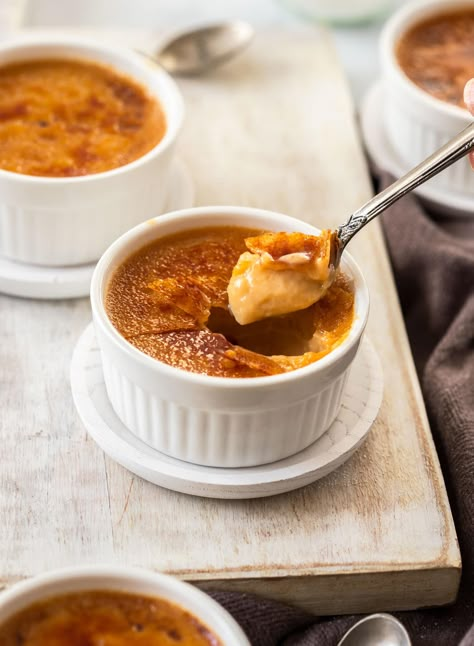 A spoon coming out of a creme brulee filled with dessert. sitting on a white board Caramel Creme Brulee Recipe, Caramel Creme Brulee, Oh Sweet Basil, Creme Brulee Recipe, Brulee Recipe, Pudding Mousse, Creme Brûlée, Creme Caramel, Sweet Basil