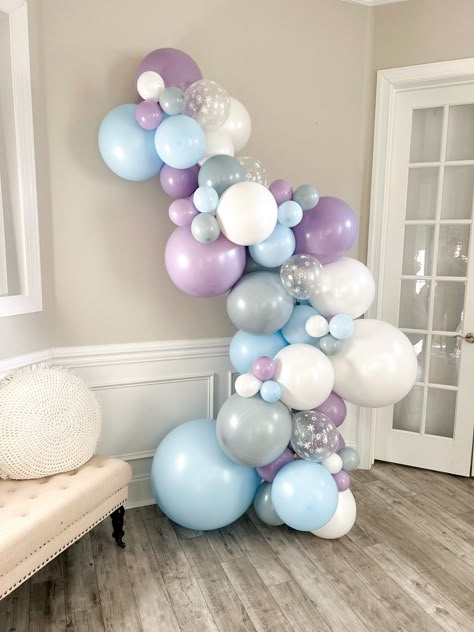 When it comes to planning a winter party, creating the right atmosphere is key. You want your guests to feel cozy, festive, and excited. One way to achieve this is through the use of warm lighting. Hang string lights across the room or place candles on tables to create a warm and inviting glow. Elsa Balloon Decoration, Elsa Balloon Garland, Frozen Balloon Decorations, Winter Balloons, Winter Wonderland Party Ideas, Ice Princess Party, Frozen 3rd Birthday, Frozen Birthday Party Decorations, Elsa Birthday Party