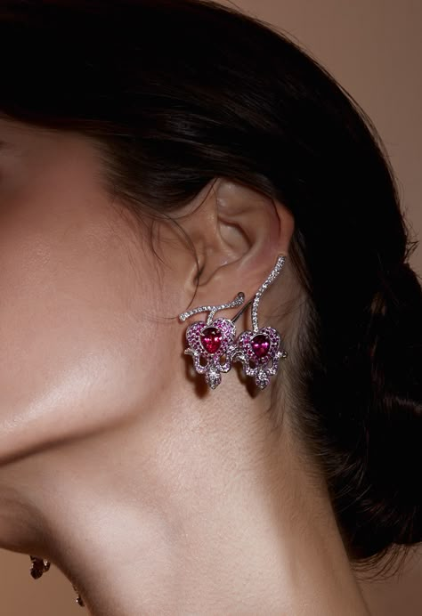 Florealis is inspired by the intricate beauty of flowers. These high jewelry earrings blend geometric abstraction with organic allure, capturing floral essence in mesmerizing diamond patterns. Pink sapphires accentuate Rubellites, evoking Bleeding Heart flowers' delicate disposition. Ingenious clip systems ensure effortless wear, maintaining carefree volume. Discover elegance in motion. Diamond High Jewelry, High Jewelry Earrings, High Jewellery, Red Elegant Luxury Flower Earrings, Luxury Ruby Jewelry With Intricate Design, Luxury Red Flower Earrings, Luxury Fine Jewelry Flower-shaped Earrings, Fine Jewelry Red Flower-shaped Jewelry, Pink Diamond Jewelry