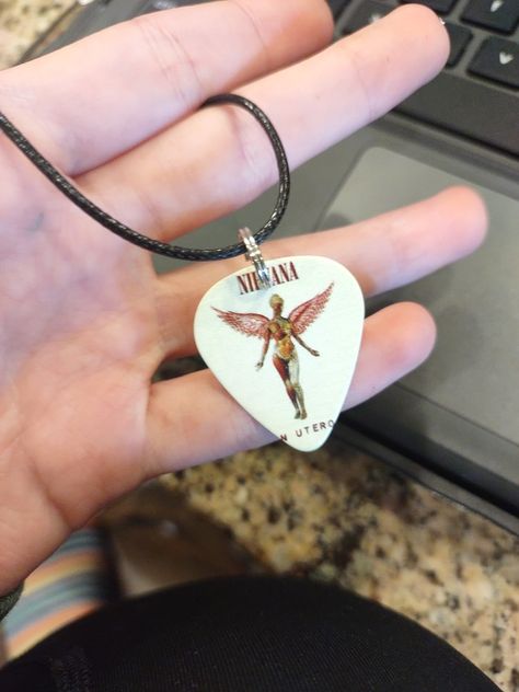 Nirvana Guitar Pick Necklace Nirvana Necklace, Nirvana On Guitar, Nirvana Guitar, Guitar Pick Necklace Diy, Nirvana Guitar Pick, Guitar Pick Holder Necklace, Necklace Guitar Pick, Pick Necklace, Guitar Pick Jewelry