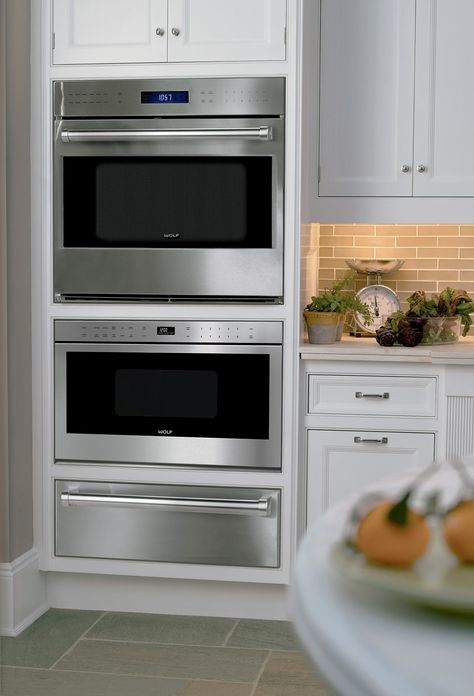 "MADE FOR EACH OTHER To create a beautifully coordinated suite of Wolf appliances, the built-in ovens are designed to be installed in a "tower" configuration with other Wolf cooking products, including the convection steam oven, drawer-style or door-front microwave, and warming drawer." Love this combo Wolf Oven, Wall Oven Microwave Combo, Luminaria Diy, Wolf Appliances, Wall Oven Microwave, Steam Oven, Single Oven, Smitten Kitchen, Warming Drawer