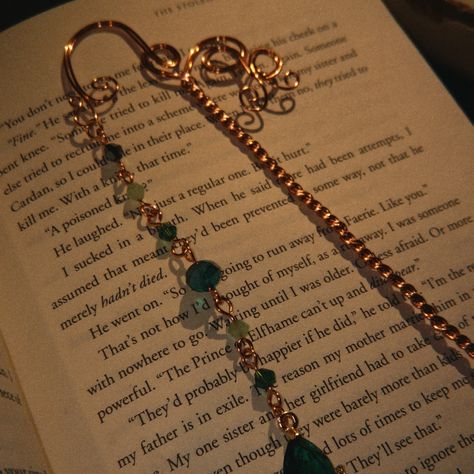 Bookmarks are here!📚 Do you find yourself always with a book on your hands, traveling from one world to another? These bookmarks will sure remind you of all the adventures you’ve been on with your favorite books⚔️ Wire wrapped bookmarks with beautiful charm chains because a lovely book spine deserves a stunning charm chain, just like we deserve stunning jewelry!🌞 🌻 DM for details 🌻 #bookmarks #handmade #wirewrapping #wirewrap #bookstagram #booklover #bookaddict Bookmarks With Charms, Chain Bookmark, Bag Poses, Book Spine, Charm Chain, Bookmarks Handmade, Find Yourself, Book Addict, Stunning Jewellery