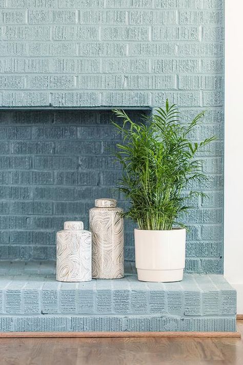 Blue Painted Brick Fireplace, Painting Brick Interior Wall, Painted Brick Wall Interior, Raleigh Photography, Flower Care Tips, Round Concrete Dining Table, Painted Brick Wall, Brick Wall Living Room, Brick Fireplace Wall