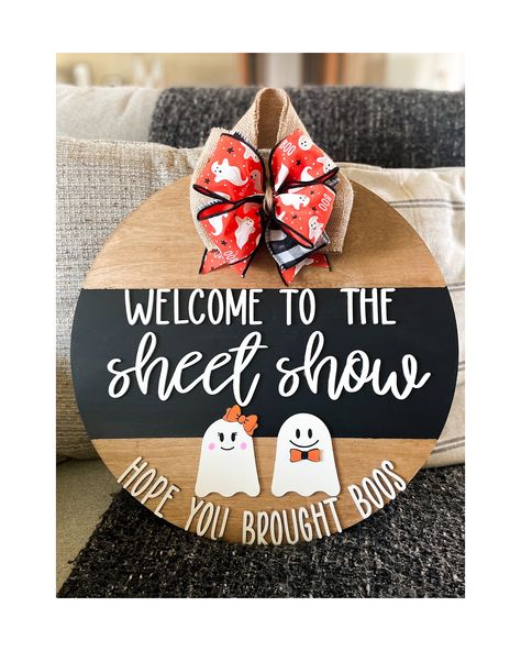 Welcome to the sheet show- hope you brought boos! DETAILS: -18' round and 1/2 inch thickness. -Laser cut wood lettering painted white. -Bow to match attached.  -High quality burlap attached to back for easy hanging. ** Although we do seal each sign for protection, it is not recommended to leave on uncovered porch for long periods of time. Halloween Circle Signs, Fall Door Signs Diy, Front Door Sign Ideas, Uncovered Porch, Fall Door Signs, Homemade Door, Ghost Door Hanger, Door Sign Ideas, Round Door Hangers