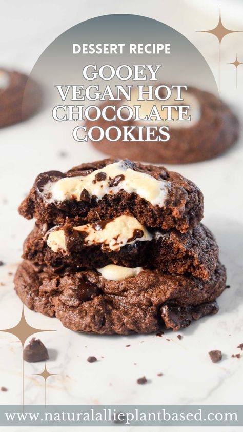 Experience the delight of winter in a cookie with our Gooey Vegan Hot Chocolate Cookies! These warm, gooey vegan hot chocolate cookies are more than just a treat. Filled with melty marshmallows nestled in a soft chocolate cookie, they are the perfect embodiment of your favorite Vegan Hot Chocolate. This Hot Chocolate cookie recipe brings you the joy of a cozy cookie that will remind you of your favorite winter drink. Vegan Hot Chocolate Cookies, Hot Chocolate Cookie, Hot Chocolate Cookie Recipes, Chocolate Cookie Recipe, Soft Chocolate Cookie, Healthy Hot Chocolate, Hot Cocoa Cookies, Vegan Hot Chocolate, Vegan Marshmallows