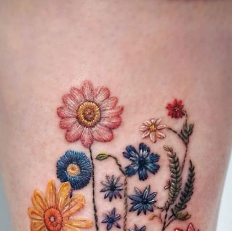 ᴇᴅᴍᴏɴᴛᴏɴ ᴛᴀᴛᴛᴏᴏ on Instagram: "Embroidery wild flowers🌷🌻🌼
.
.
.
.
.
.
.
.
.
.
#edmontontattoo #yegtattkk #yyctattoo #calgarytattoo #reddeertattoo #embroideryflowers #embroiderytattoo #embroideryart #wildflowertattoo  #flowertattoo #yegcolortattoo" Embroidery Tattoo Flower, Embroidered Tattoo Design, German Flower Tattoo, Embroidery Flower Tattoo, Zinnia Tattoo Ideas, Embroidery Wild Flowers, Embroidery Tattoo Ideas, Cutesy Tattoos, February Flower Tattoo