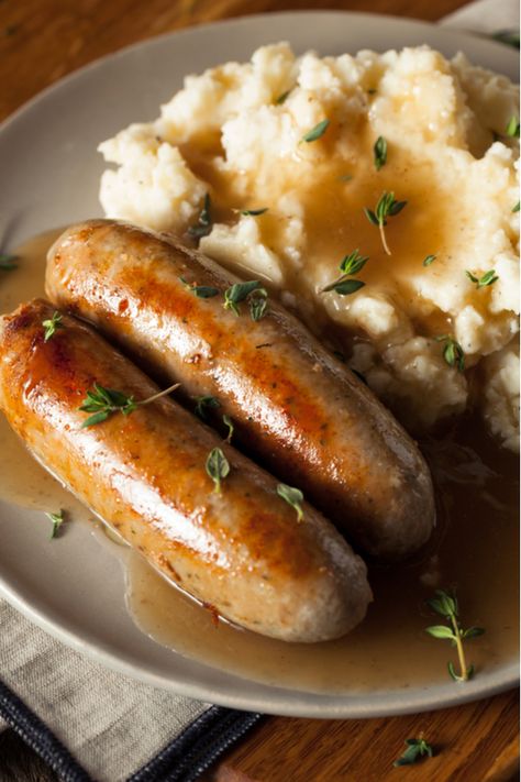 Bangers and Mash Recipe - A St. Patrick's Day Favorite! Oven Roasted Corned Beef, Bangers And Mash Recipe, Pork Sausages, British Dishes, Mash Recipe, Tomato Relish, Bangers And Mash, Onion Gravy, Corn Beef And Cabbage