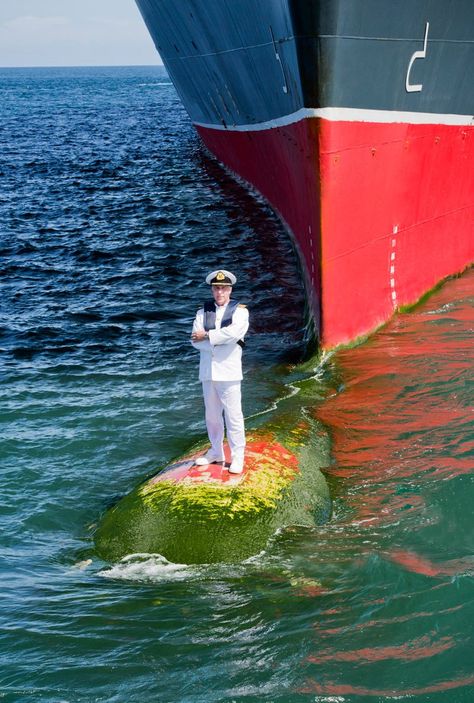 Captain Kevin Oprey, Master of Queen Mary 2, standing on the ship’s bulbous bow (a protruding bulb at the front of a ship just below the waterline) a mile off the coast of Bali. Photographer James Morgan, 2014. Queen Mary Ii, Epic Pictures, Navi A Vela, Merchant Navy, Merchant Marine, Cruise Liner, Cargo Shipping, Round The World, Tall Ships