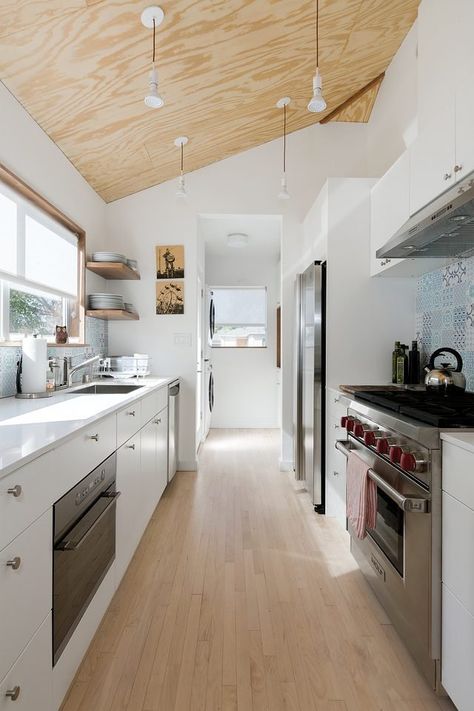 There's nothing quite like a fresh, clean, white kitchen. But if a white kitchen is modern in style, it doesn't mean that it also has to be stark, cold, and sterile in feel. From pristine cabinetry to paint colors to accessories, there are so many ways to work white in your cooking space. Check out these 10 ideas that can bump up your modern, white kitchen a notch. White Galley Kitchens, White Galley Kitchen, Attic Kitchen, Beach Style Kitchen, Kitchen Triangle, Galley Kitchen Design, Galley Kitchens, Kitchen Redesign, Casa Container