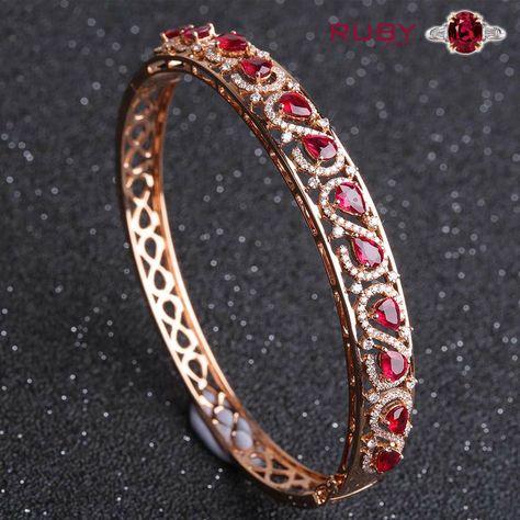 Gorgeous design of ruby stone bangle can be wear for any occasion Red Stone Bangles In Gold, Ruby Bracelets, Jewelry Pics, Ruby Bangles, Temple Jewelry Necklace, Gold Jewelry Outfits, Gold Bangles For Women, Diamond Bangles, Diamond Wedding Jewelry