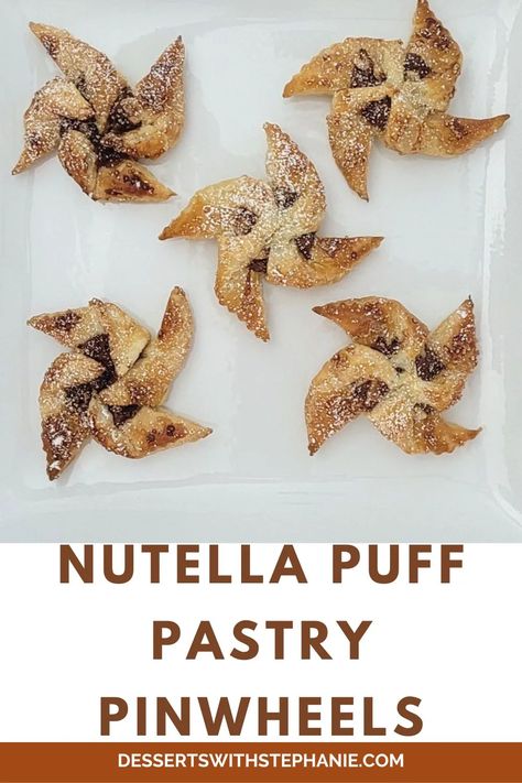 Nutella Puff Pastry Pinwheels: Flaky, buttery layers of the puff pastry combined with the creamy Nutella and crunchy hazelnuts make these a crowd-pleasing treat. #nutelladesserts #puffpastry #pastypinwheels #easydessert via @https://www.pinterest.com/DessertsWithStephanie/ Nutella Puff Pastry, Puff Pastry Pinwheels, Nutella Desserts, Pinwheel Recipes, Chocolate Hazelnut Spread, Pastry Tart, Chocolate Hazelnut, Puff Pastry, Sweet Snacks