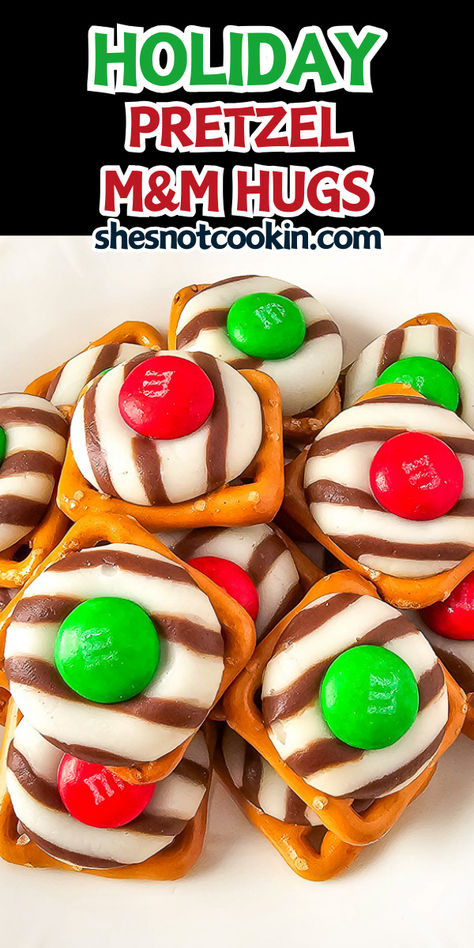 Cute pretzel Christmas hugs on a white plate. Christmas Hugs Pretzels, Pretzels Hugs And M&ms, Pretzel Peppermint Kisses And M&ms, Pretzel Hershey Kiss M&m Christmas, Hershey Hugs Pretzels, Pretzel And Kisses Recipe, Class Party Treats Christmas, Pretzels With Hershey Kisses And M&ms, Christmas Work Treats