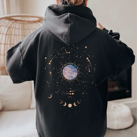 Moon Phase Hoodie Oversized Hoodie, Witchy Clothes, Celestial Sweatshirt, Trendy Aesthetic Pullover Graphic Hoodie, Cottagecore Clothing This unisex heavy blend hooded sweatshirt is relaxation itself. Made with a thick blend of cotton and polyester, it feels plush, soft and warm, a perfect choice for any cold day. In the front, the spacious kangaroo pocket adds daily practicality while the hood's drawstring is the same color as the base sweater for extra style points. .: 50% cotton, 50% polyester (fiber content may vary for different colors) .: Medium-heavy fabric (8.0 oz/yd² (271 g/m .: Classic fit .: Tear-away label .: Runs true to size Hoodies Womens Aesthetic, Moon Clothes Aesthetic, Moon Outfit Aesthetic, Hoodie Design Ideas Aesthetic, Creative Hoodie Design Ideas, Spacecore Outfits, Space Aesthetic Outfit, Comfy Clothes Aesthetic, Aesthetic Hoodie Design