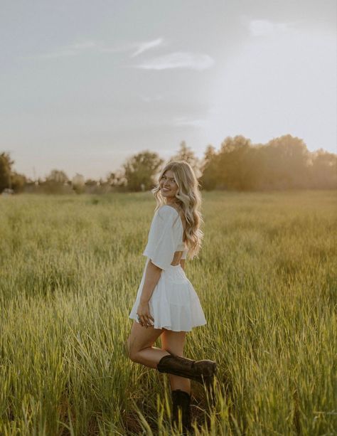 Cute Photo Shoot Poses, Flower Field Photoshoot Outfits, Field Senior Photoshoot, How To Pose People For Pictures, Girl Senior Portraits Outfits, White Dress With Cowboy Boots Senior Photos, Cute Country Senior Pictures, Senior Poses Field, Western Outfits Women Photoshoot