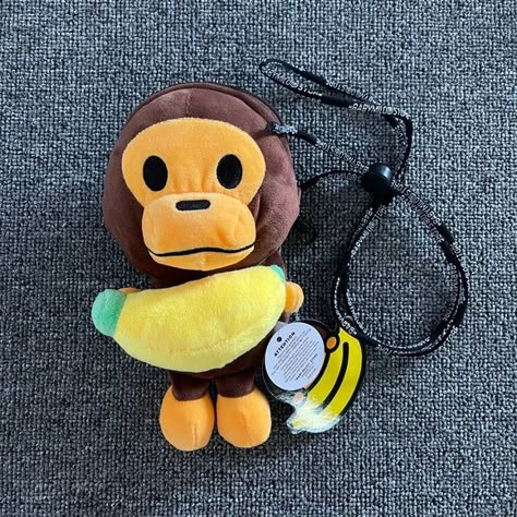 Baby Milo Phone Banana Bag Kaws Murakami, Milo Bape, Indie Ideas, Fashion Grails, Cute Banana, Baby Milo, Banana Bag, Vinyl Art Toys, Monkey 3