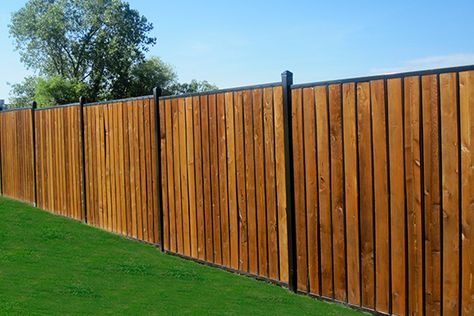 Rot-Proof Fence Posts: For Low Maintenance, Try a Steel Fence with Wooden Infills - Fortress Fence Corner Lot Fence Ideas, Galvanized Fence Post, Galvanized Fence, Wood Privacy Fence, Privacy Hedge, Fencing Material, Steel Fence, Privacy Fences, Wooden Posts