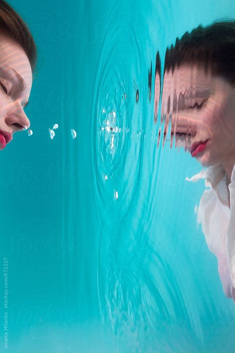 Reflection of a woman submerged under the water surface by JovanaMilanko | Stocksy United Water Reflection Reference, Person Reflection In Water, Under The Surface Art, Reflections On Water, Water Mirror Photography, Water Surface Photography, Mirror Reflection Art, Underwater Reflection, Lying In Water