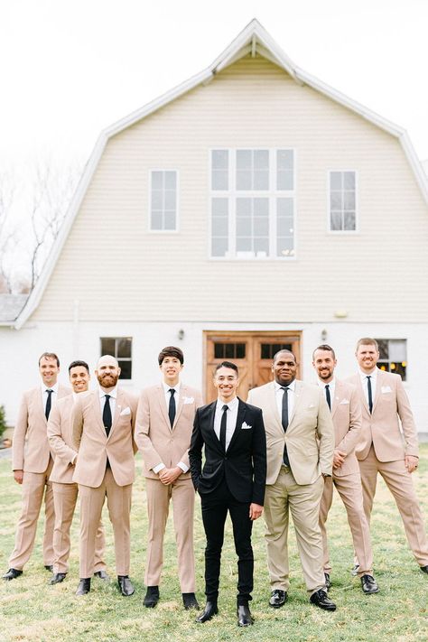 The groom wore classic black tux and groomsmen wore tan suits for a black and tan rustic wedding  #weddingphotos #virginiawedding #barnwedding #weddingparty #groomsmen #tanwedding #beigewedding #weddingportraits #rusticwedding #weddingideas #weddinginspiration #farmwedding #weddingvenue #48fields Black Groom Tan Groomsmen, Groom In Beige Groomsmen In Black, Tan Groomsmen Suits Black Groom, Tan Suit With Black Tie, Khaki And Black Groomsmen Attire, Black Tux Groom Tan Suit Groomsmen, Black And Beige Wedding Party, Tan And Black Suit Wedding, Black And Beige Groomsmen