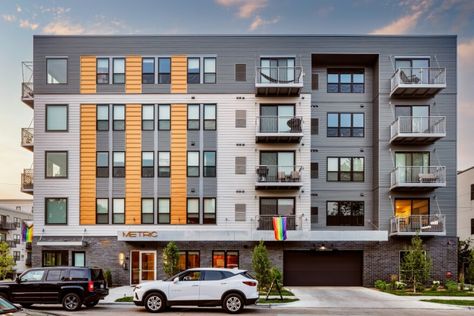 Striking Facades Transform Low- and Mid-Rise Apartments into Urban Showpieces | Architect Magazine Mid Rise Apartment, Mid Rise Building, Low Rise Building, Low Rise Apartment, Standing Seam Roof, Architect Magazine, Cladding Systems, Metal Cladding, Ribbed Paneling