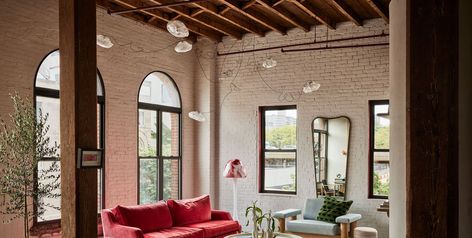 “I come in here and I see a lot of great conversations,” says Orior creative director Ciaran McGuigan. Brooklyn Loft, Blue Velvet Sofa, Brooklyn Apartment, Style Loft, New York Apartment, Style Deco, Low Ceiling, Vintage Chairs, Making Room