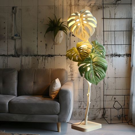 Illuminate your living space with this exquisite Monstera-inspired corner lamp. The sleek frame, adorned with intricate monstera leaf patterns, casts beautiful shadows, creating a serene oasis. The soft, warm LED glow offers a cozy ambiance, perfect for relaxing evenings. With a sturdy base and adjustable height, this lamp enhances any corner with botanical charm and contemporary style. Conceptual AI Art Follow @ecosapiens for more! Corner Lamp, Leaf Patterns, Cozy Ambiance, Monstera Leaf, Leaf Pattern, Contemporary Style, Oasis, Living Spaces, It Cast